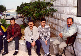 Photo: Staff sitting outside Birzeit's administration building during the strike