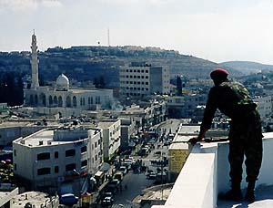 Photo: Palestinian Policeman overlooks Ramallah