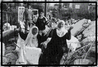 Women mourn their crumbled homes